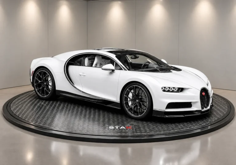 A STAK turntable with a hypercar parked on the rotating platform in a showroom
